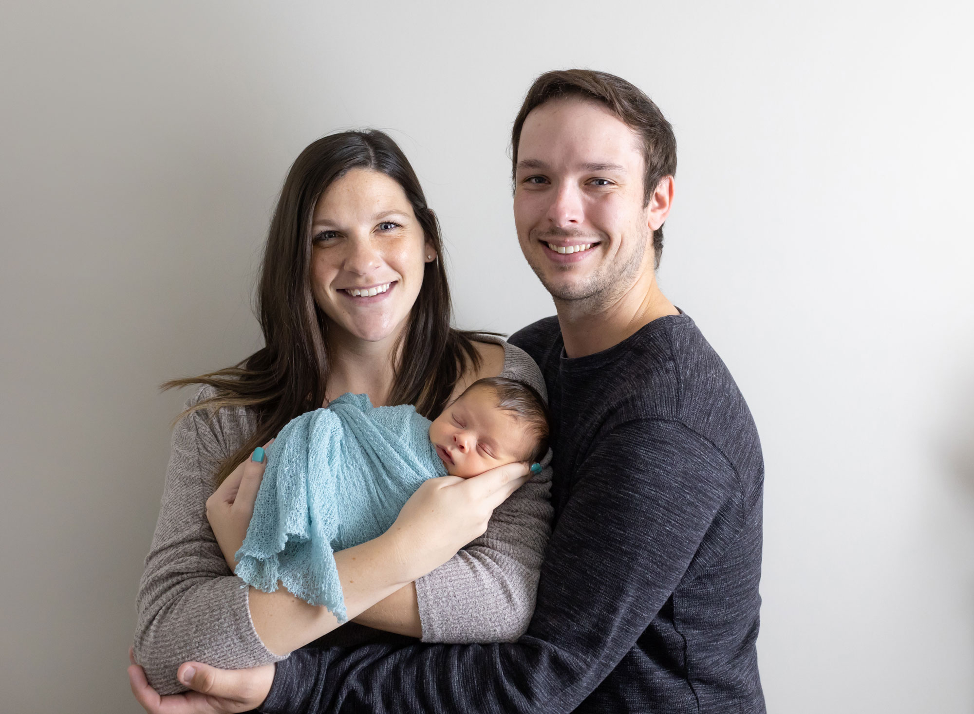 couple holding newborn boy