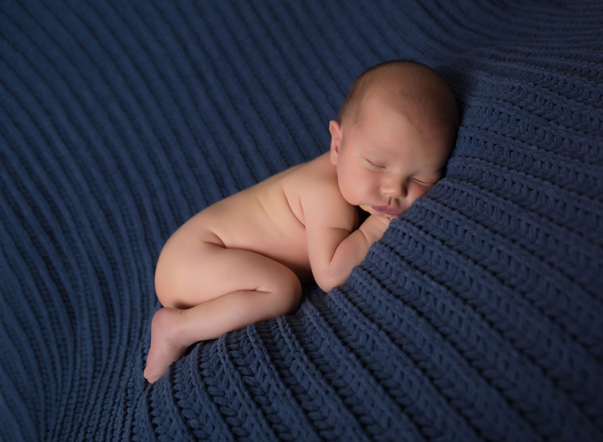 newborn-boy-blue-blanket