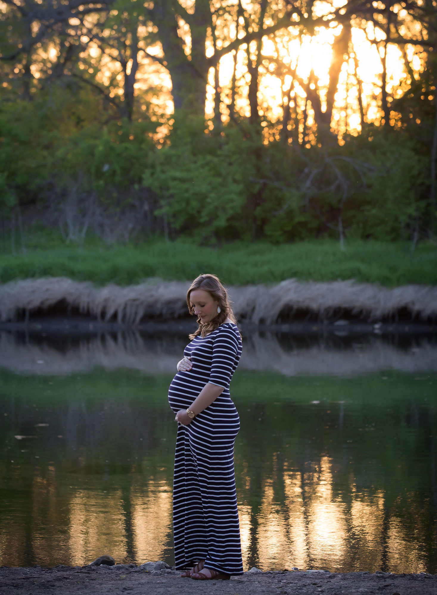 pregnant-woman-river-sunset