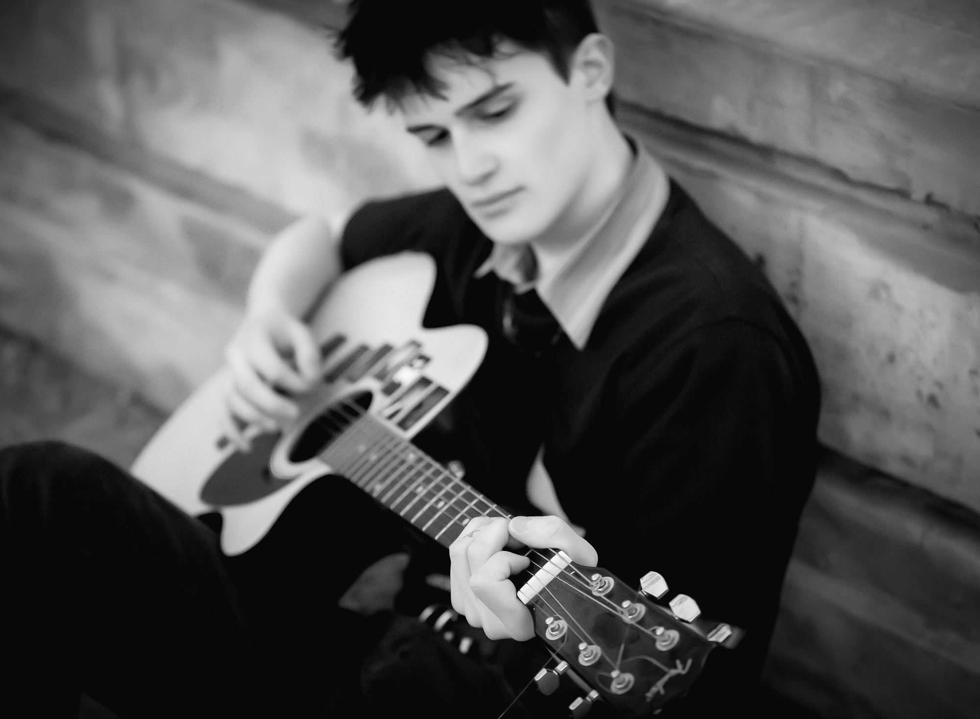 senior-boy-playing-the-guitar