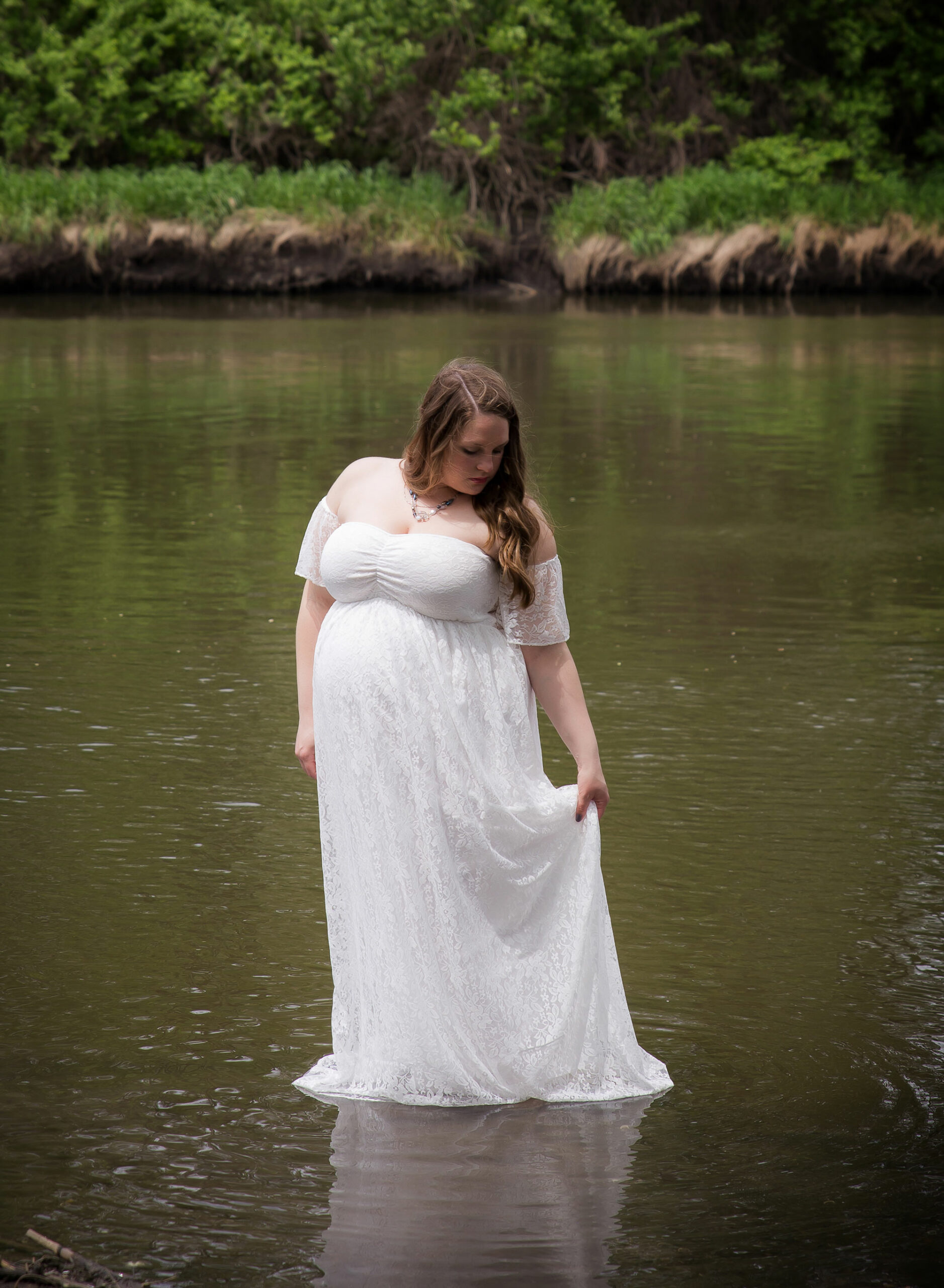white-dress-standing-creek
